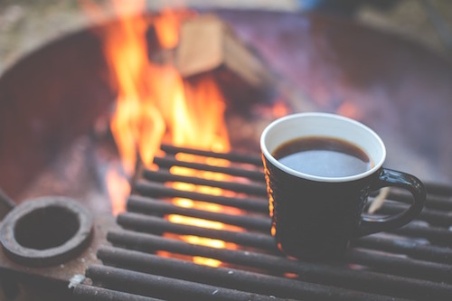 coffee beside a camp fire